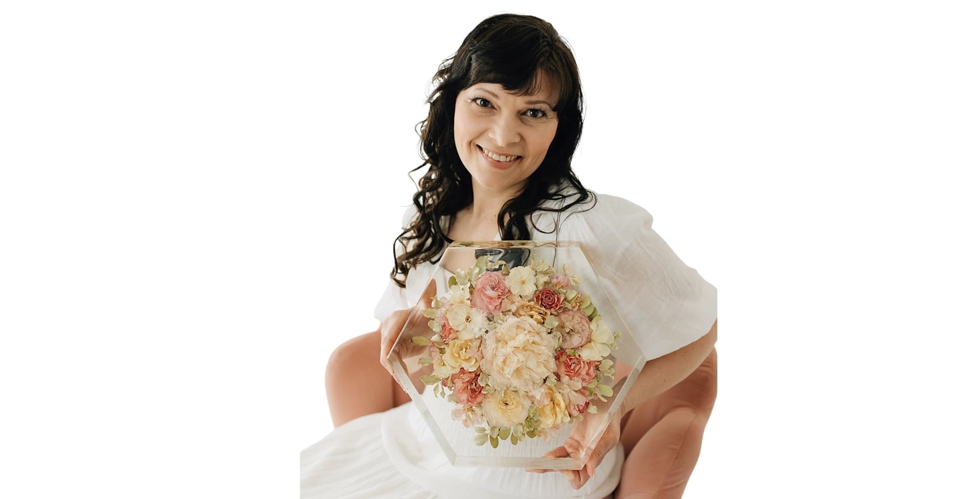 women-holding-flowers-preserved-in-resin