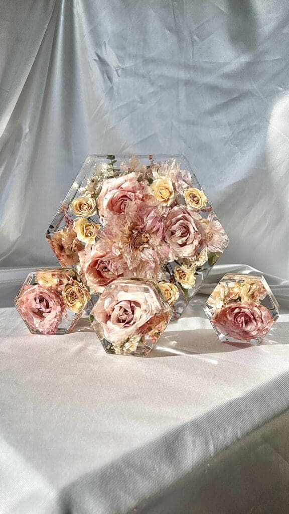 Blush and white flowers preserved in resin
